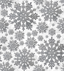 seamless background from silver snowflakes