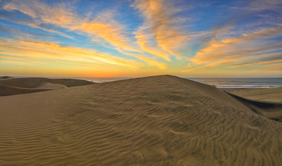 Fototapeta na wymiar Sand dunes in famous natural Maspalomas beach. Gran Canaria. Spain