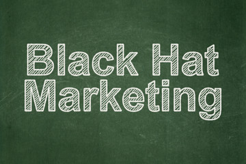 Obraz premium Advertising concept: text Black Hat Marketing on Green chalkboard background