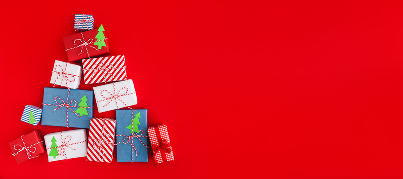 Holiday background with a christmas presents. Panorama, flat lay.