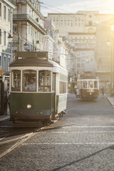 Plakat Famous Lisbon trams on the street.