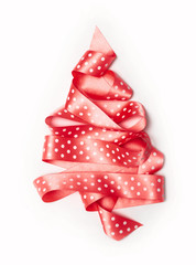 Christmas tree from pink ribbon tape isolated on a white background