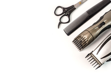 The machine for a hairstyle and hair trimmer. Hair clippers and hair trimmer with comb and scissors...