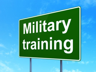 Education concept: Military Training on green road highway sign, clear blue sky background, 3D rendering