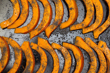 Tasty fresh Red kuri squash pumpkin preparation with poppy