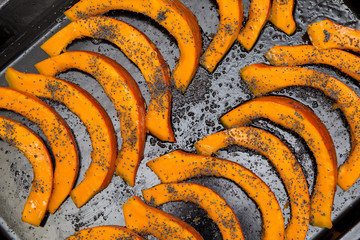 Tasty fresh Red kuri squash pumpkin preparation with poppy