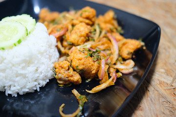 Spicy salad fried chicken with rice