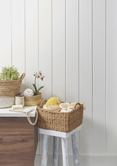 wicker basket and wooden cabinet in the bathroom style