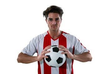 Football player holding football with both hands