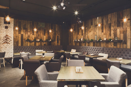 Cozy wooden interior of restaurant, copy space
