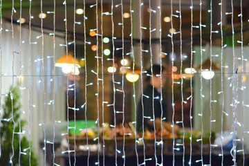 Bokeh from lights with barbecue background.