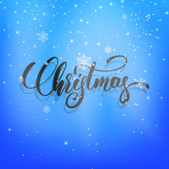 Christmas. Christmas script lettering on the snow winter background. Winter holiday card with snowflakes and calligraphy