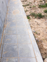 Concrete tile pavement with the barrier.