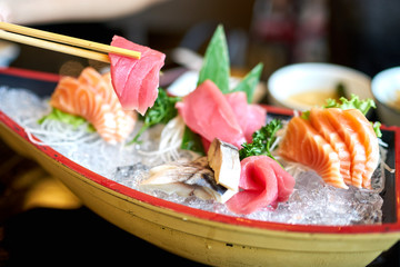 Eating fresh Sashimi, Japanese food