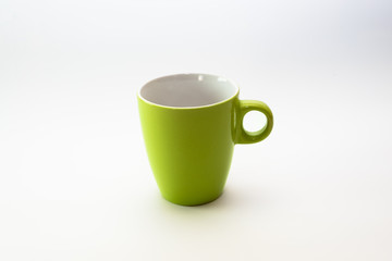 Green cup or mug, isolated on white, clean background. Minimalist design