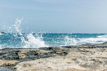landscape of wave splash on rock at coast in Malta 