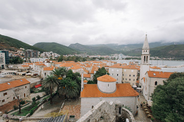 Fototapeta premium Beautiful panorama of budva oldtown rooftops and mountains