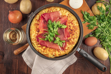 Spanish tortilla with wine, ingredients, and copy space