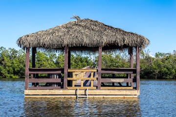 Thatched Roof Pier at the Bay - 182724719