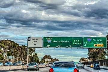 Tuinposter Exit signs in 405 freeway in Los Angeles © Gabriele Maltinti