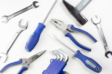 New working tools on a white background (hammer, keys, screwdriver, pliers, imbus)