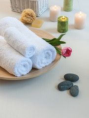 Obraz na płótnie Canvas decorative relax time spa center concept white towel and rock design with candle