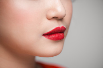 Fototapeta premium Close-up of beautiful perfect red lips. Selective focus.