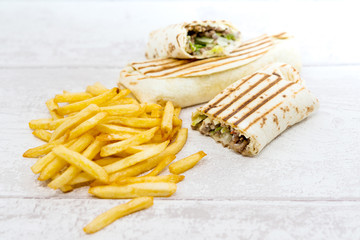Mexican fajita wraps with grilled chicken fillet and fresh vegetables