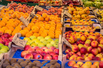 Fruit boxes with plums and peaches