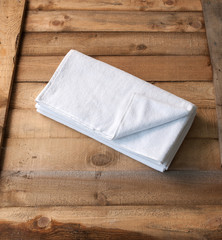 modern loofah brush behind wooden table spa center concept