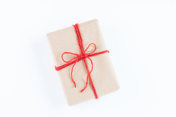 brown paper package with red twine for Christmas