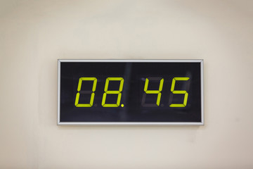 Black digital clock on a white background showing time