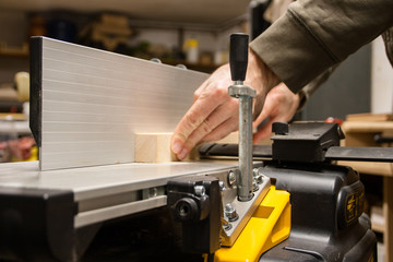Woodworking, planing wood on a jointer