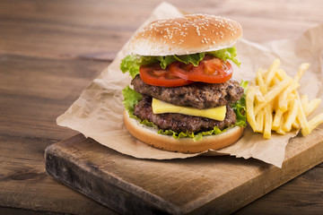 Fresh burger on wooden background