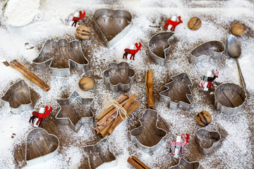 Fototapeta na wymiar Christmas food background with cookies molds and flour
