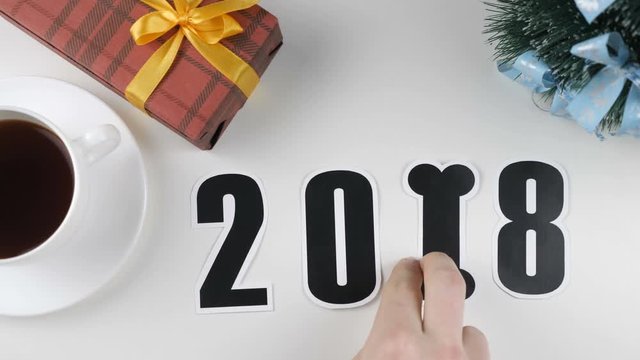 Illustration, new year, male hand changes digit one to the bone.