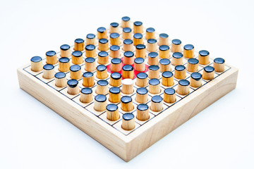 Naklejka premium the one white in black of Wooden Revessi Othello game close up of Different wood stick on white background with a clipping path,Business concept, Selective focus