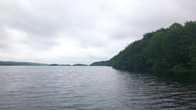 Handheld smartphone pan over scenic Ireland lake