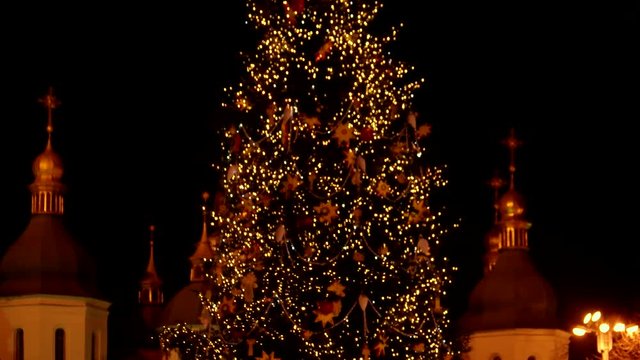 Great decorated christmas tree in the downtown. Sparkling christmas tree.