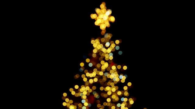 Blured top of the christmas tree. Alternative lights.