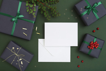 Christmas paper sheet card on dark green background, card with envelope, letter to santa