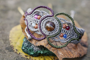 Fototapeta premium Macrame material handmade bracelet on natural background