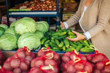 Woman buying groceries at green market.