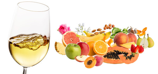 White wine fruit and plant aromas next to wine glass.