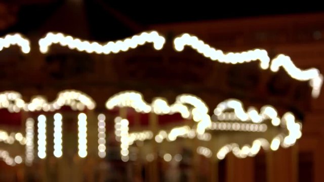 Blured carousel is moving. Motion background.