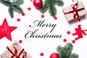 Merry Christmas on a Christmas background with presents red stars fir branches and copy space in...