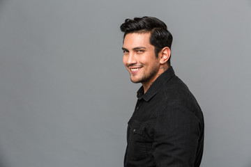 Obraz premium Handsome young cheerful man standing isolated