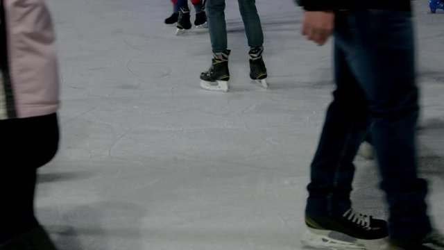 Close-up view on an ice rink. Crowded ice rink.