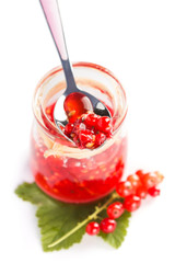 Red current homemade jam on white background