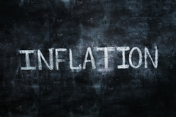 The word on The board, inflation, white chalk on black Board